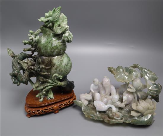 A Chinese jadeite dragon carving and a jadeite group largest 21cm